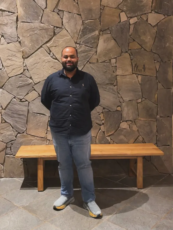 CA Arpan Sood standing in the office